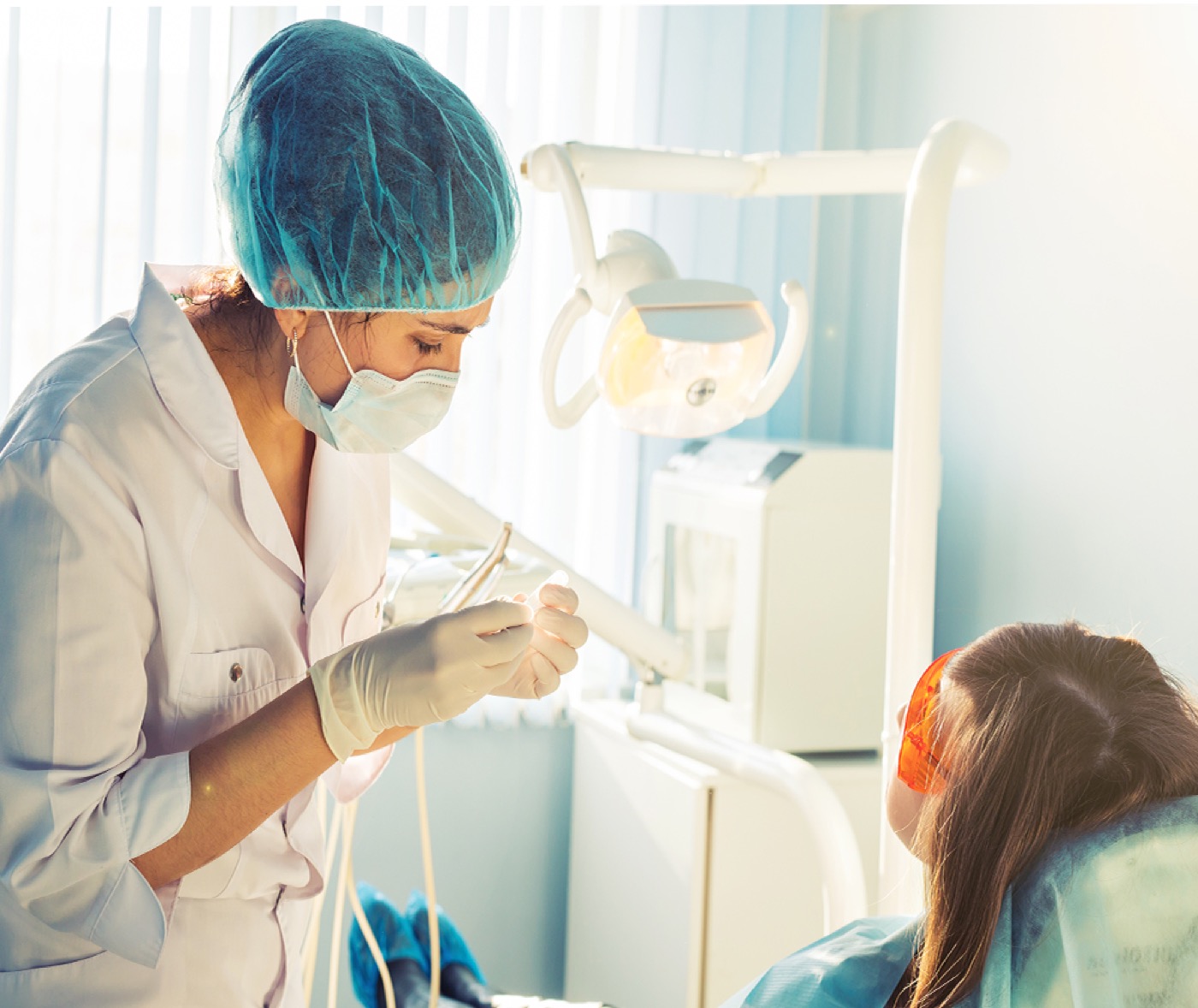 Dentist treating a patient at Dental House